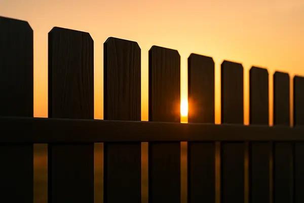 a piquet wooden fence with the sunset in the background from Dallas Fence Company in Dallas, TX - aluminum fence contractors a piquet wooden fence with the sunset in the background from Dallas Fence Company in Dallas, TX - aluminum fence contractors