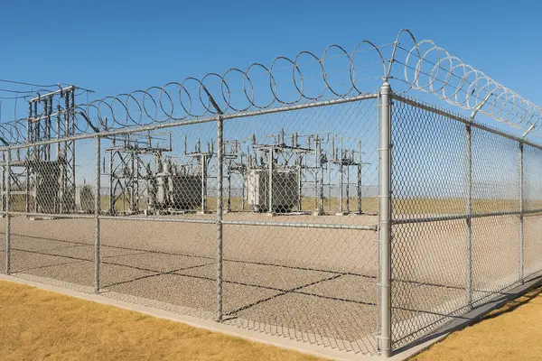 an electric substation surrounded by a chain fence from Dallas Fence Company in Dallas, TX - Fence Repair Company an electric substation surrounded by a chain fence from Dallas Fence Company in Dallas, TX - Fence Repair Company